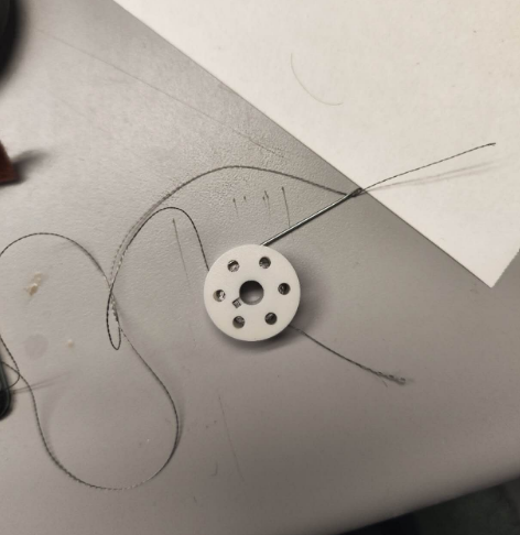 This is my attempt to understand how to light up a small bulb by conducting electricity through cloth.