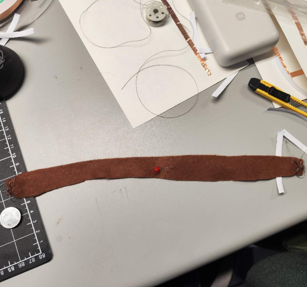 This is my attempt to understand how to light up a small bulb by conducting electricity through cloth.