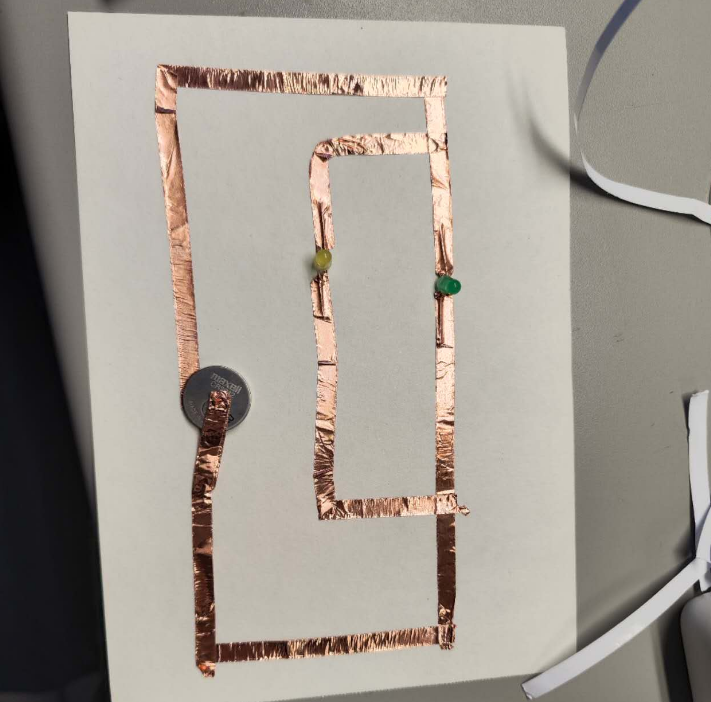 This is me trying to connect a series circuit. I've got one of the bulbs' electrodes installed in the wrong direction. I'm testing it.