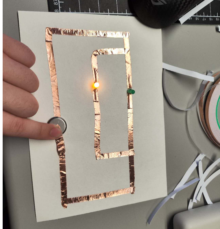 This is me trying to connect a series circuit. I've got one of the bulbs' electrodes installed in the wrong direction. I'm testing it.