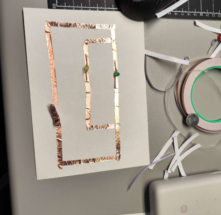 This is me trying to connect a series circuit. I've got one of the bulbs' electrodes installed in the wrong direction. I'm testing it.