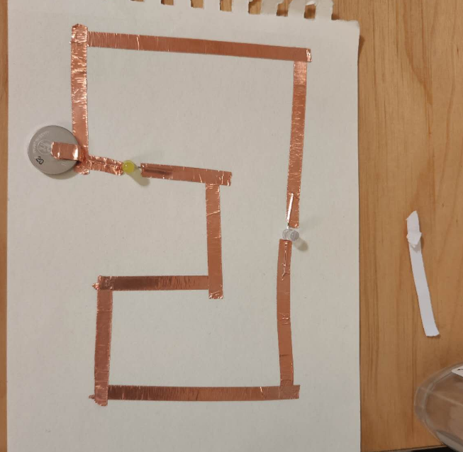 This is more tests I conducted for researching series and parallel circuits. I was testing under what circumstances the bulb would light up and whether it had anything to do with the placement of the copper foil. At what position would the copper foil touch the electrode with the bulb to light up the bulb?