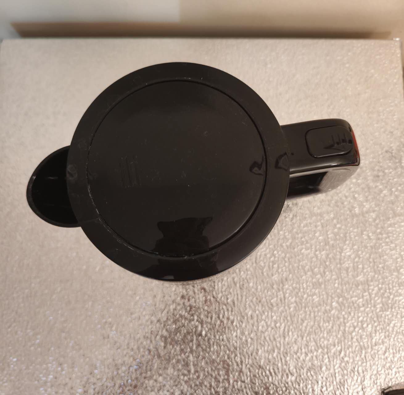 This is my electric kettle from another angle. It has a spout, a handle, and a lid. It is a complex geometry.